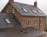 Sandblasting stonework clean during house renovation.