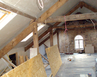 House renovation: Wooden beams during sandblasting.