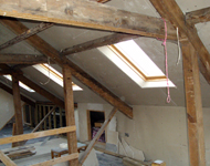 House renovation: Wooden beams during sandblasting.