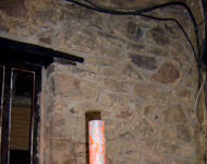 Interior of house stone walls being restored.