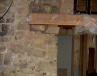 Interior of house stone walls being restored.