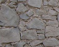 Exterior stone walls being exposed by sandblasting.