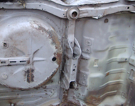 Underneath car body before sandblasting.